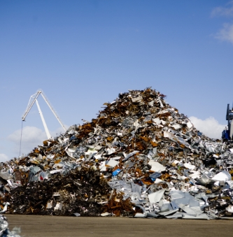 heap-of-metal-scrap-at-junkyard-against-blue-sky-2021-08-28-23-56-39-utc