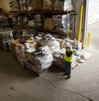 male-worker-talking-on-mobile-phone-while-standing-2022-05-25-04-46-54-utc