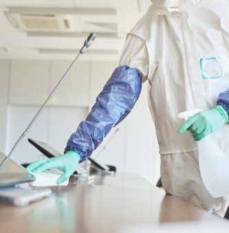 worker-cleaning-office-table-close-up-2022-02-02-03-56-17-utc